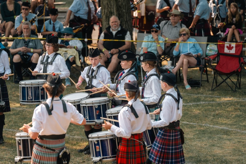 Glengarry Juvenile Pipe Band snare drummers performing at the Glengarry Highland Games